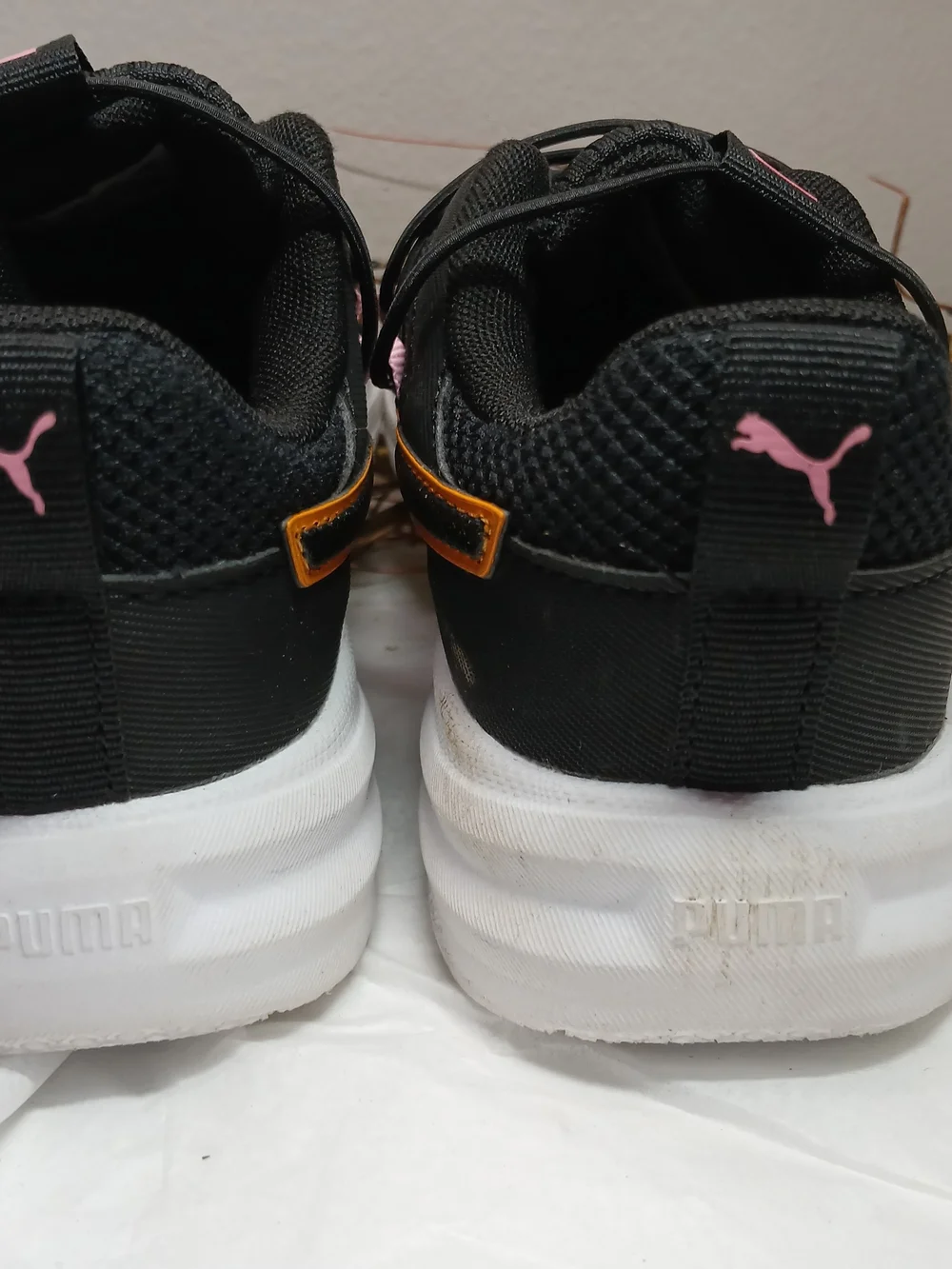 Puma Black Sneakers with Pink Accents and Orange Trim